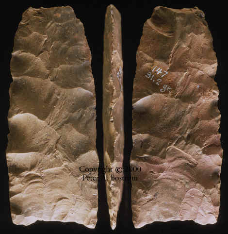 Broken Clovis point from Fenn cache triple exposed.