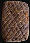Birdman tablet showing crosshatched side.