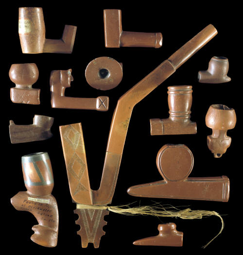 Group of 13 different types of catlinite pipes.