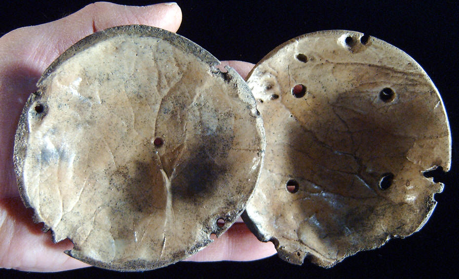 Underside of two human bone rattles from Pinson Mounds.