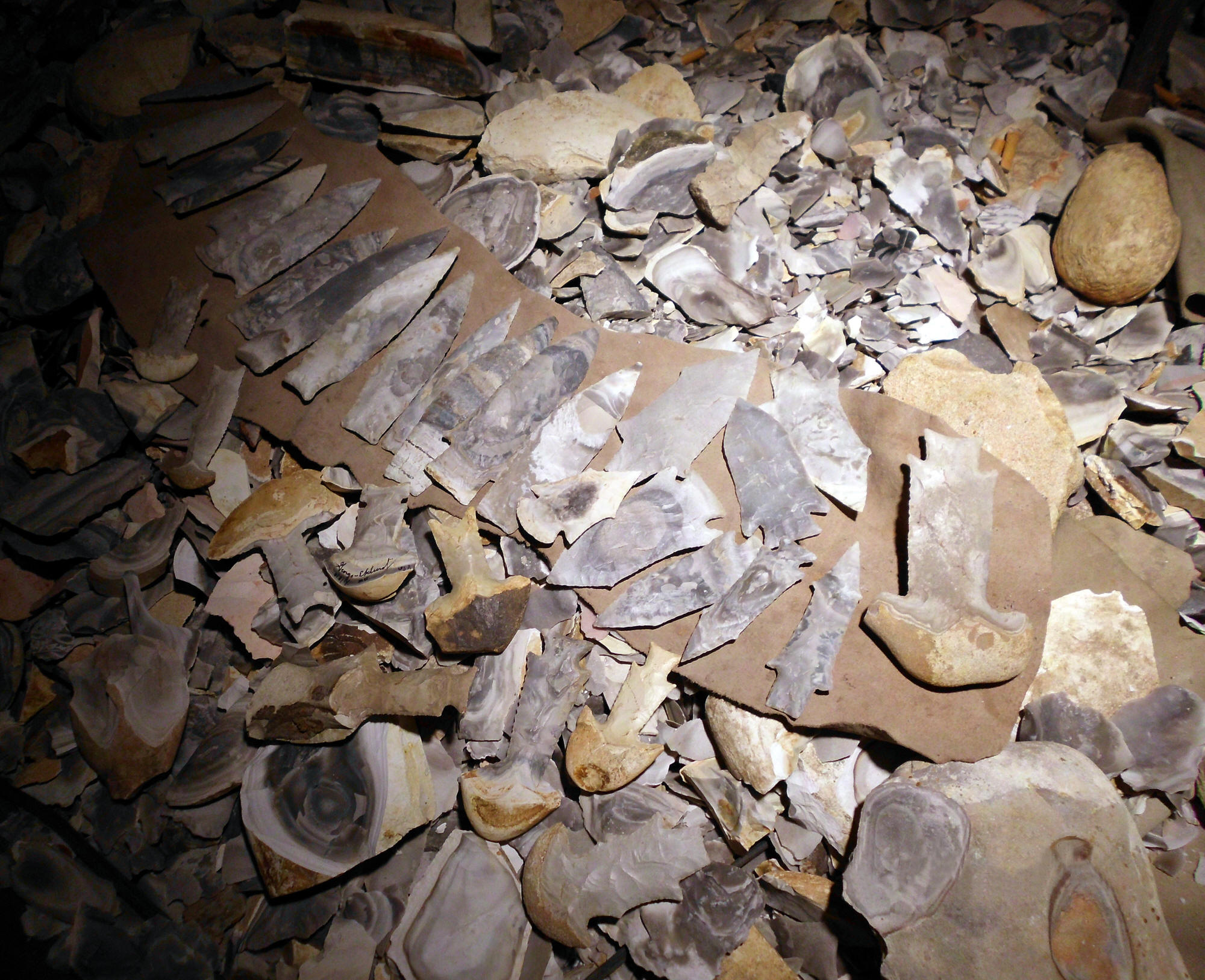 Finished points and raw stone in George Eklund's workshop.