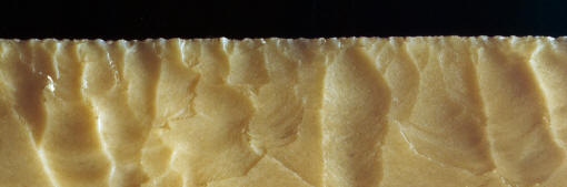 Magnified view of edge serrations on fishtail biface.