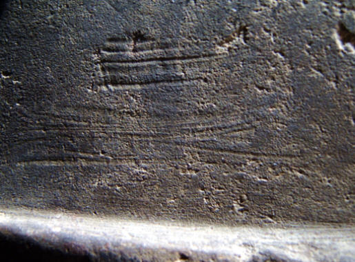 Striation marks on side of Franke pipe.