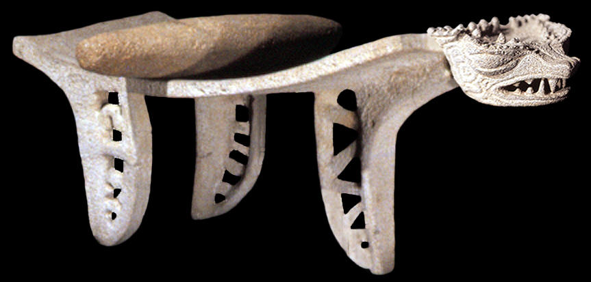 Ceremonial metate with serpent head and mono.