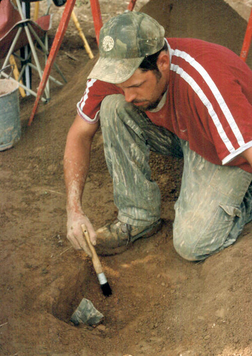 Jason Neralich discovering a prismatic blade core.