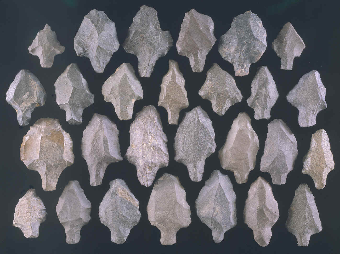 27 tanged Aterian points from Morocco, Africa.