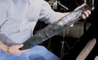 Pete Bostrom holding a large obsidian biface from California.