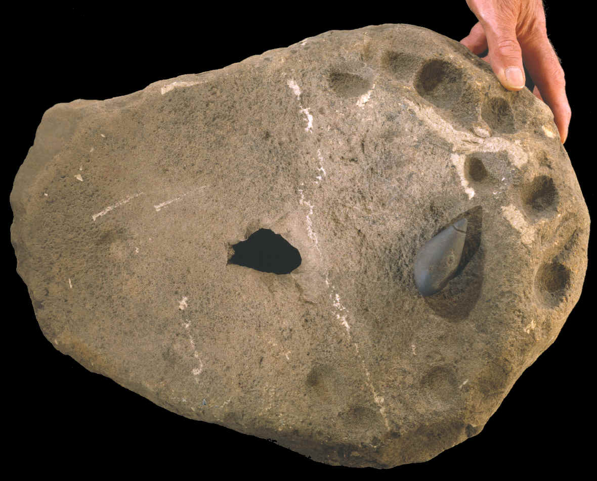 Bottom view of large hematite grinding stone.