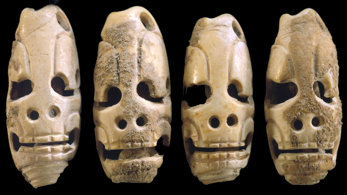 4 Mayan "death head" marine Oliva shell tinklers.