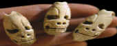 Mayan "death head" marine shell tinklers or beads.