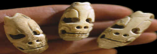 Mayan "death head" marine shell tinklers or beads.
