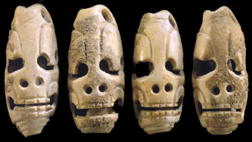 Mayan "death head" marine shell tinklers or beads.