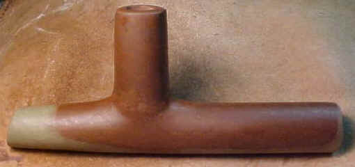 Red pipestone "T" pipe made by Gary Merlie.