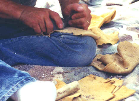 Grinding an edge prior to flaking.