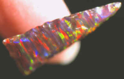 Synthetic resin opal arrow point.