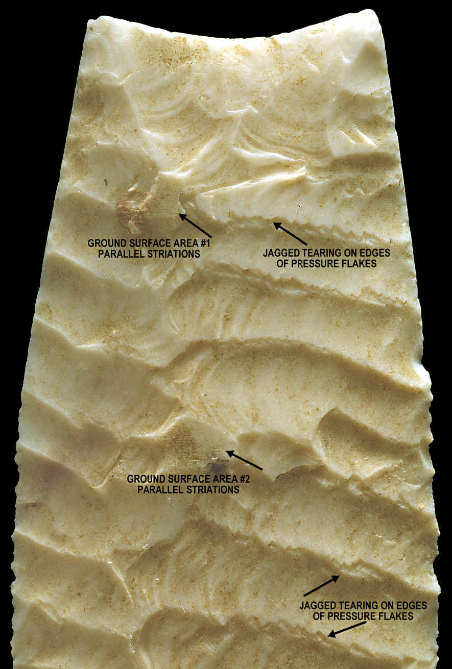 Magnified view of surface grinding and flake tearing.