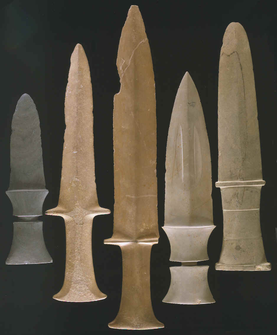 Five ground slate daggers from Asia.