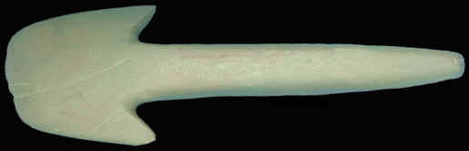 A flared bit spud made of green stone.