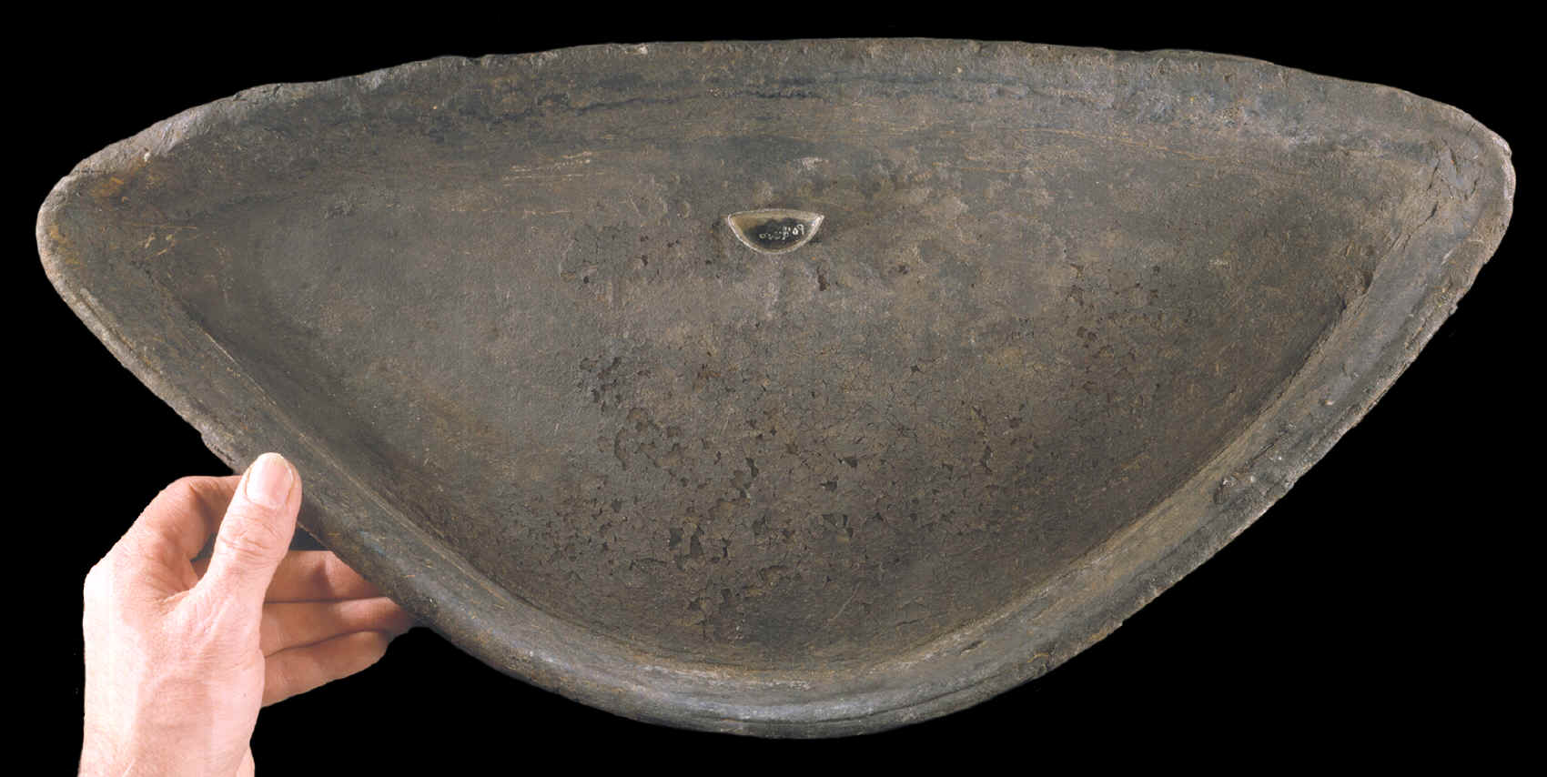 Large and miniature toy Eskimo oil lamps.