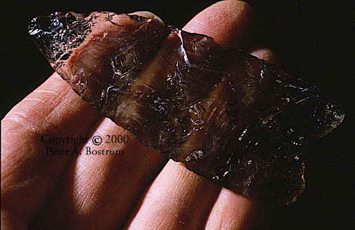 Quartz crystal Clovis point from the Fenn cache.